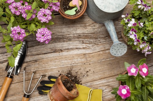 Gardener working safely with tools and protective equipment